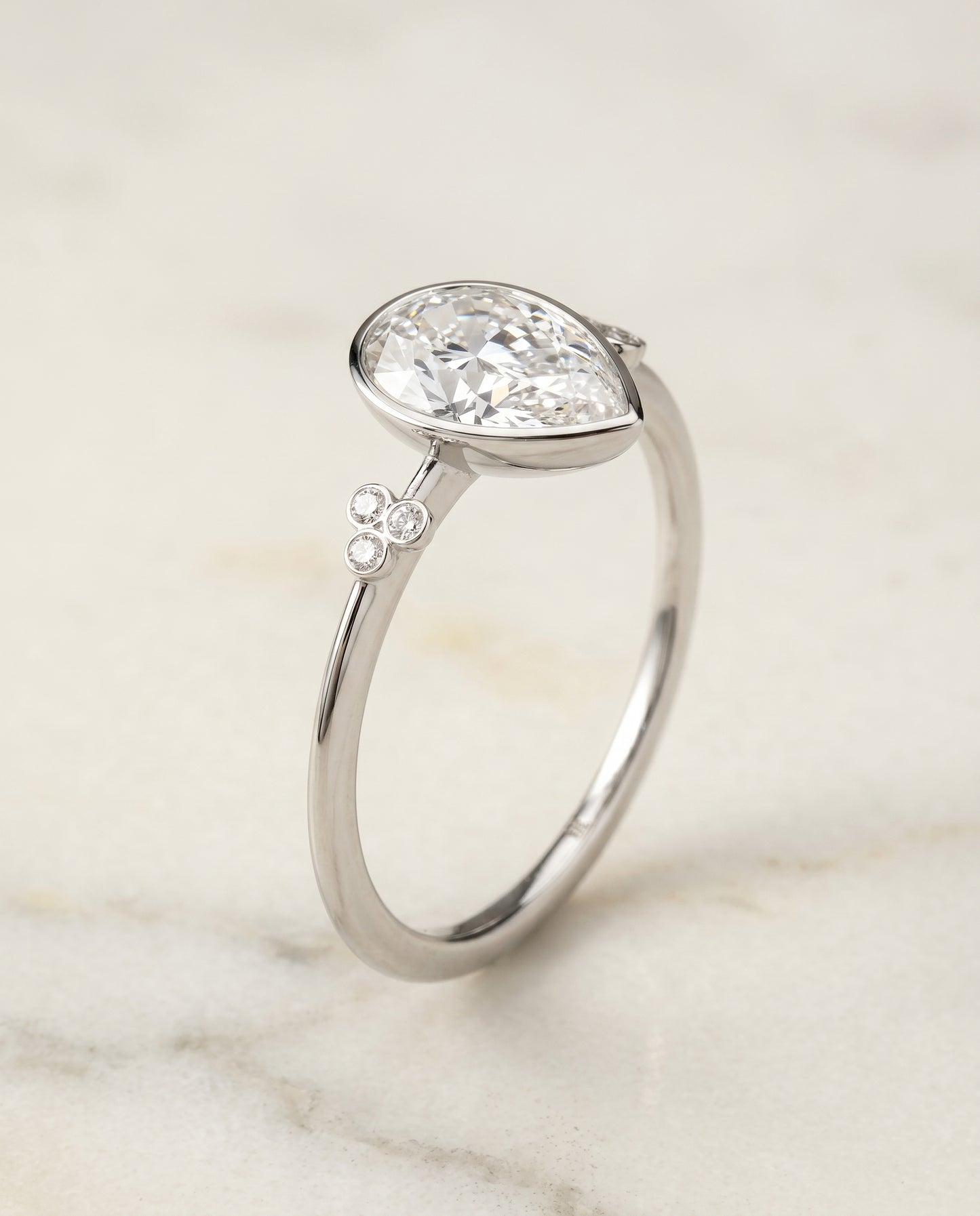 The Selena Clover Bezel Accent Solitaire Princess Cut Engagement Ring Setting in 18K White Gold