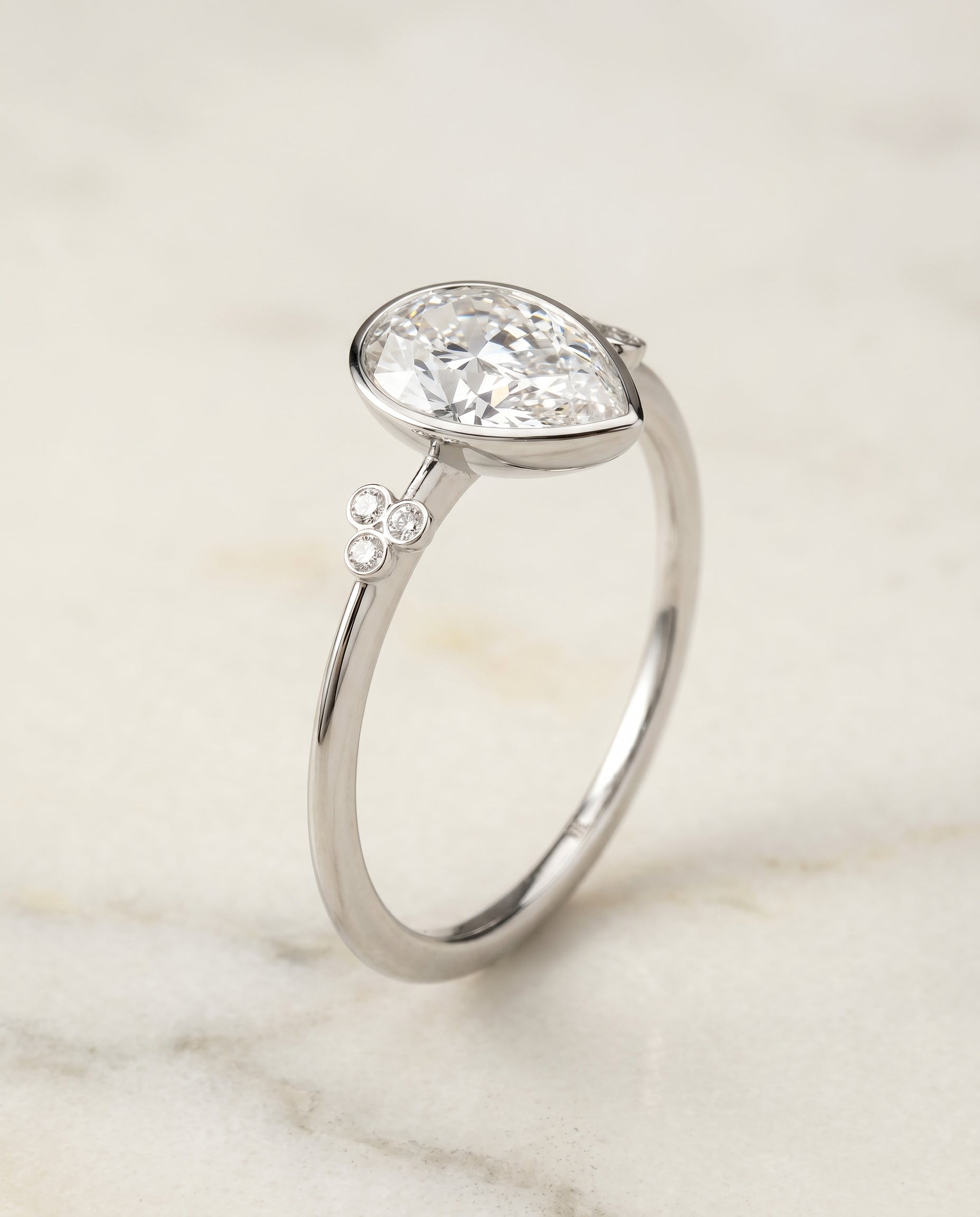 Clover Bezel Accent Solitaire styling on The Selena princess engagement ring setting | RockHer