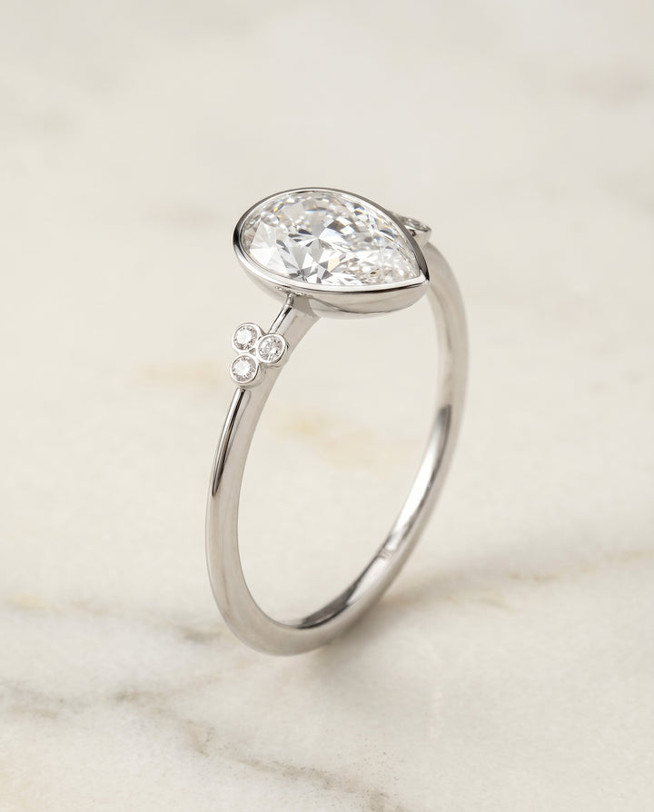 The Selena Clover Bezel Accent Solitaire Princess Cut Engagement Ring Setting in 18K White Gold