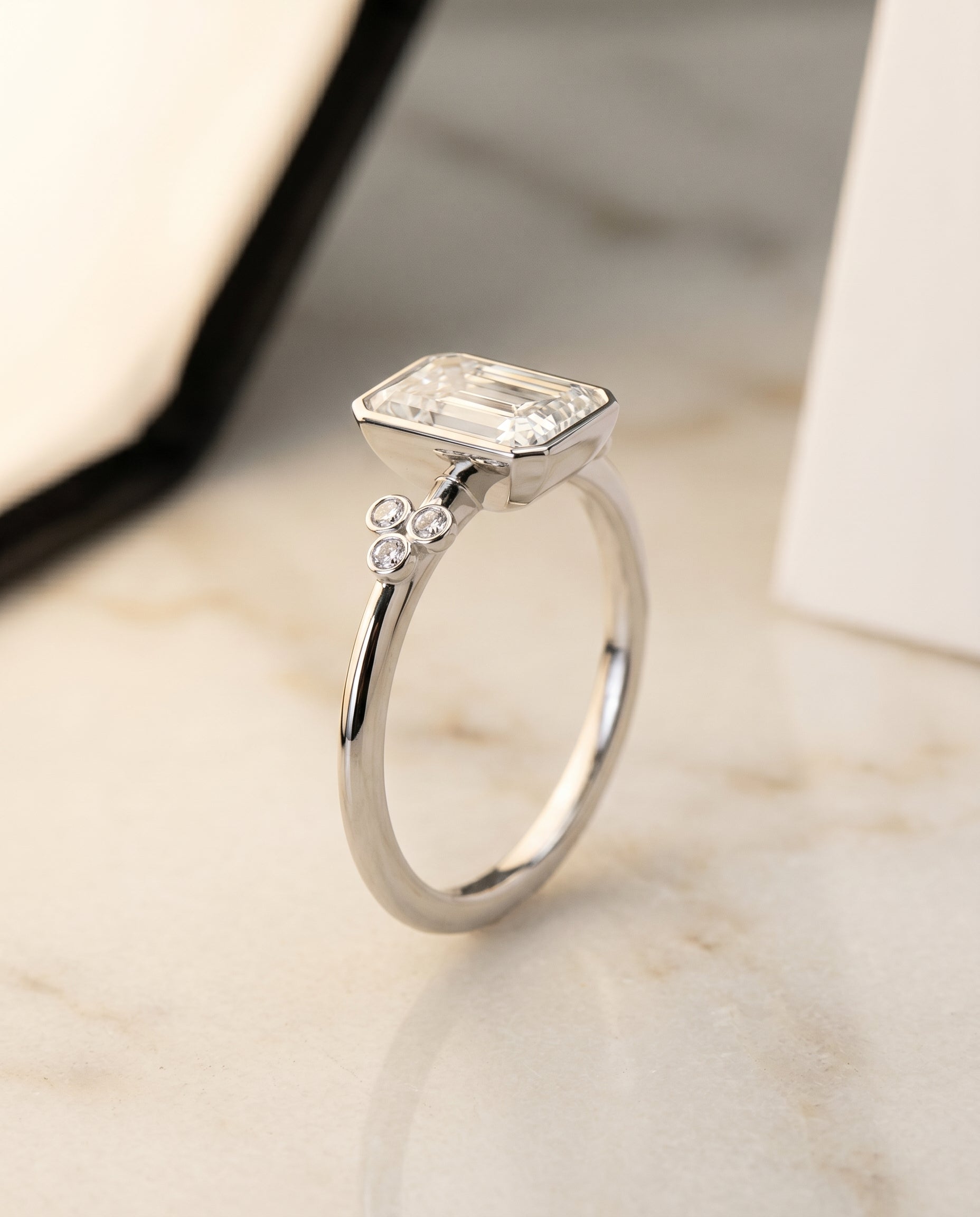 Clover Bezel Accent Solitaire Cut styling on The Selena radiant engagement ring setting | RockHer