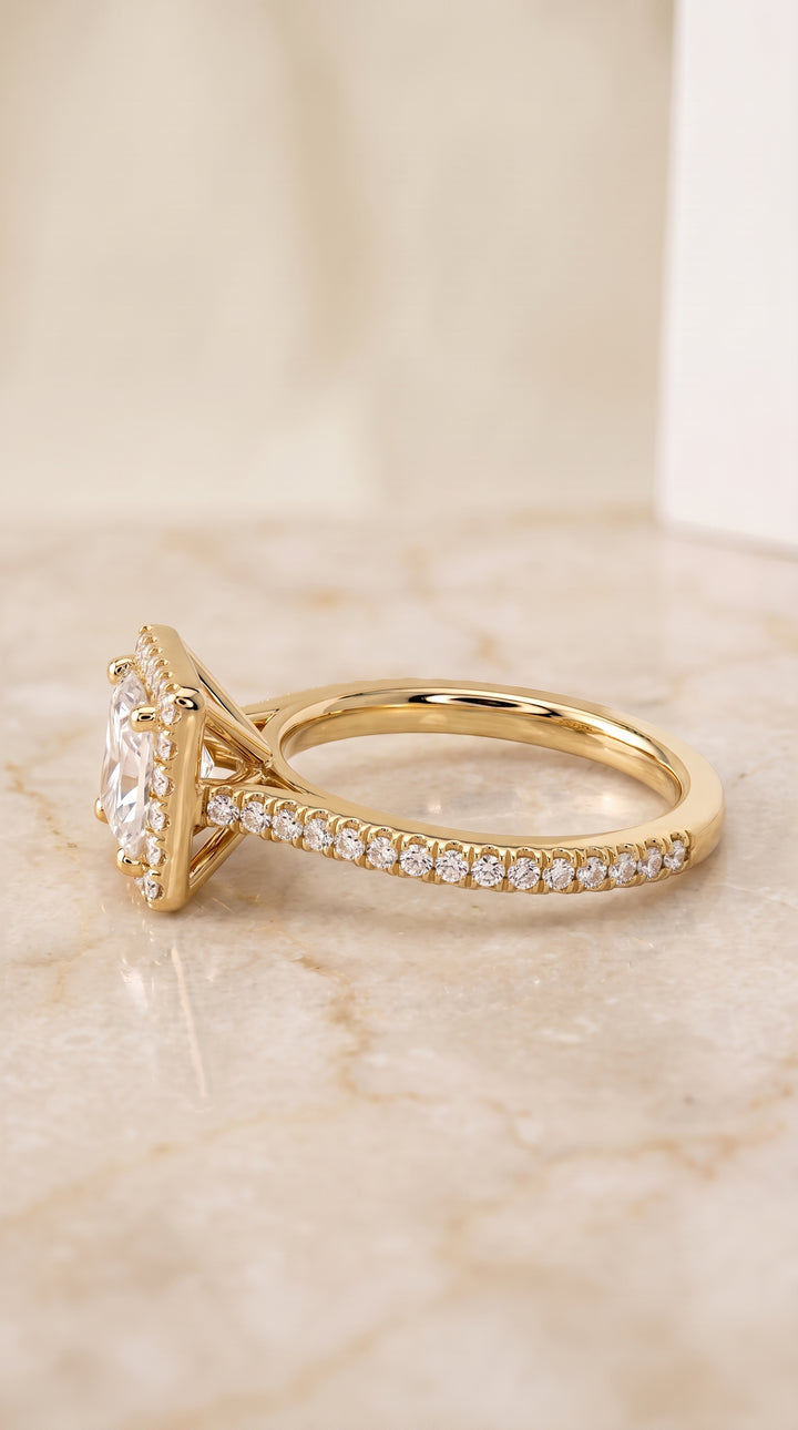 The Sonata Graduated Shank Pavé Halo Princess Cut Engagement Ring Setting in 18K Yellow Gold