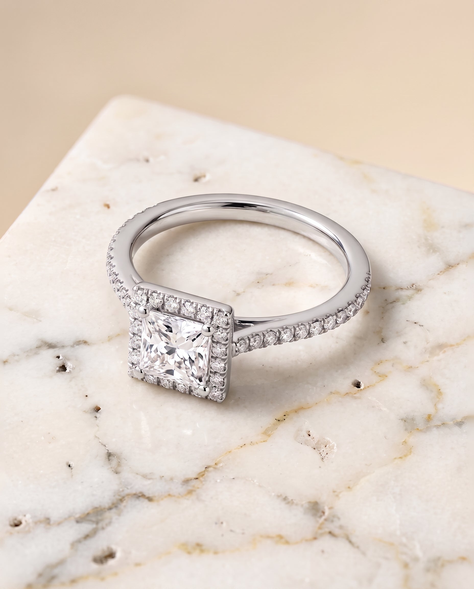 The Sonata Graduated Shank Pavé Halo Princess Cut Engagement Ring Setting in Platinum
