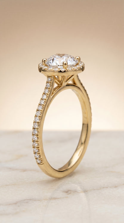 The Sonata Graduated Shank Pavé Halo Round Engagement Ring Setting in 18K Yellow Gold