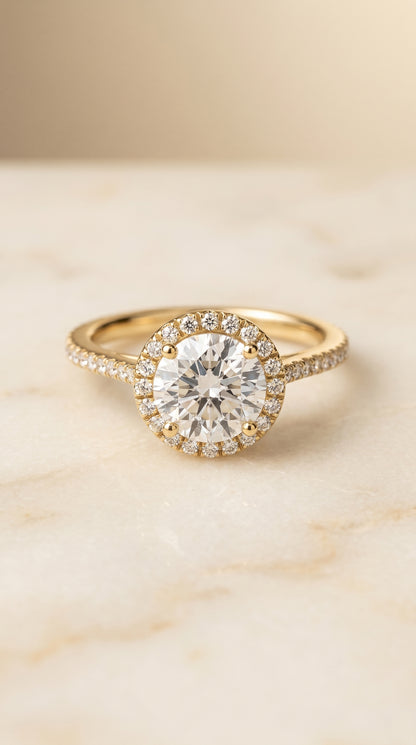 The Sonata Graduated Shank Pavé Halo Round Engagement Ring Setting in 18K Yellow Gold