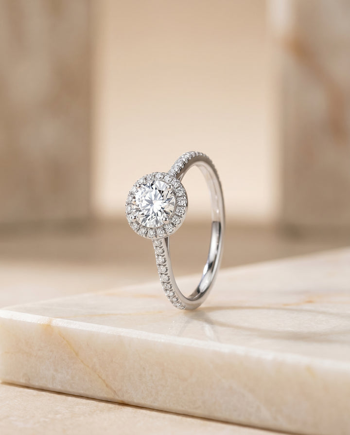 The Sonata Graduated Shank Pavé Halo Round Engagement Ring Setting in Platinum