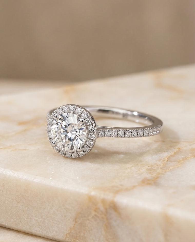 The Sonata Graduated Shank Pavé Halo Round Engagement Ring Setting in Platinum