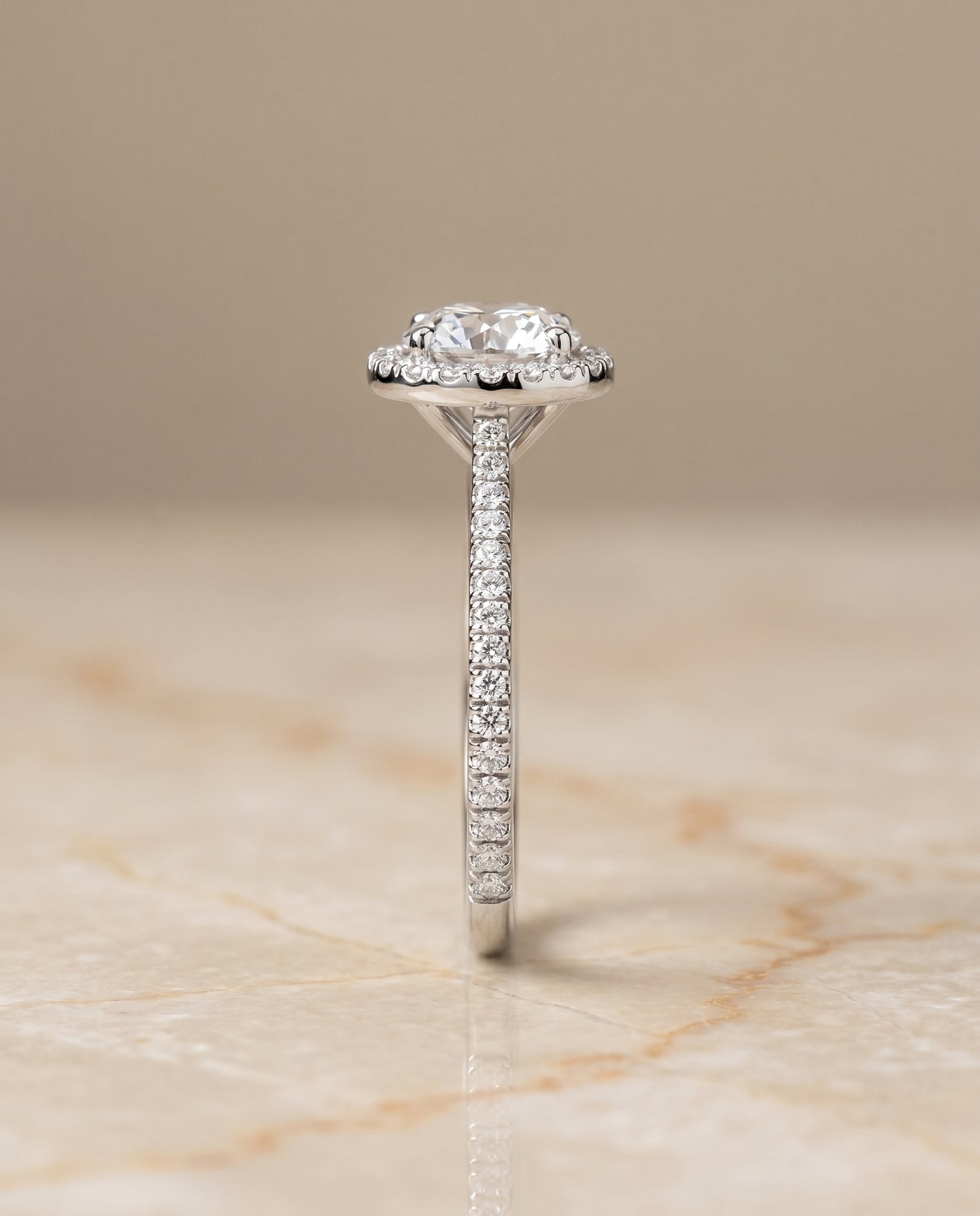 The Sonata Graduated Shank Pavé Halo Round Engagement Ring Setting in Platinum