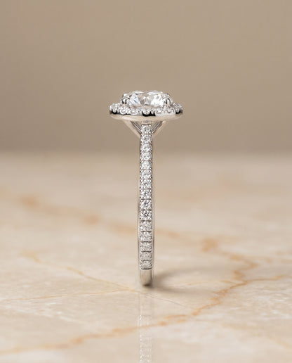 The Sonata Graduated Shank Pavé Halo Round Engagement Ring Setting in Platinum