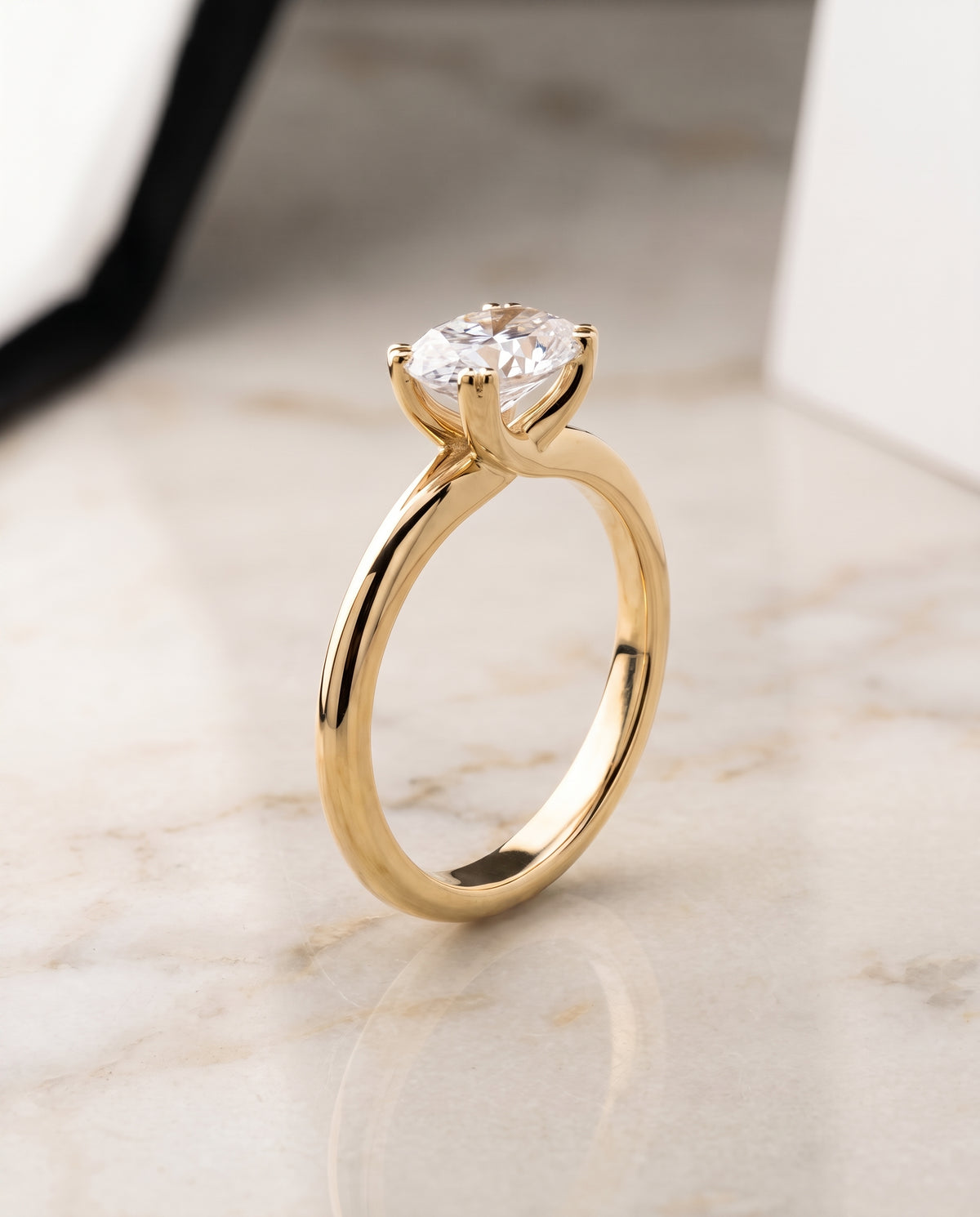 The Spring East West Eight Claw Comfort Fit Solitaire Oval Engagement Ring Setting in 18K Yellow Gold