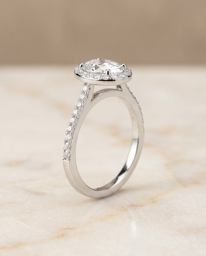 The Taylor Pavé Halo Engagement Ring Setting for Oval Diamonds in 18K White Gold