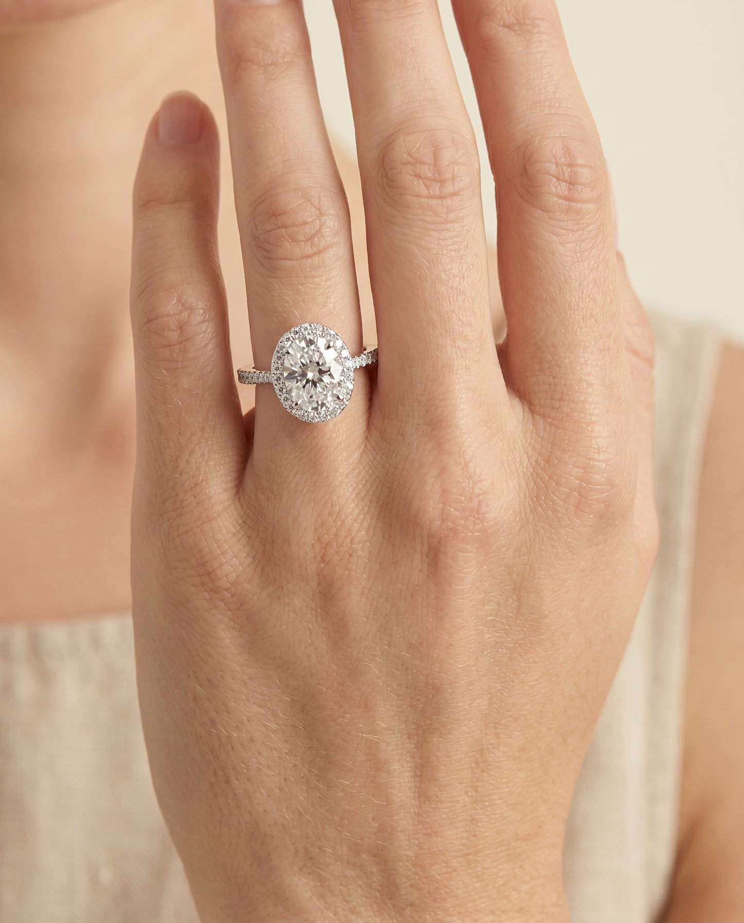 The Taylor Pavé Halo Engagement Ring Setting for Oval Diamonds in 18K White Gold