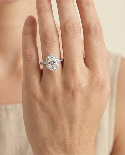 Taylor Select Pavé Halo Oval Lab Diamond Engagement Ring in 18K White Gold, shown on hand | RockHer