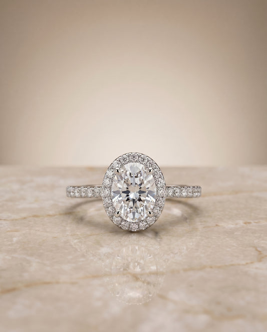 The Taylor Pavé Halo Engagement Ring Setting for Oval Diamonds in Platinum