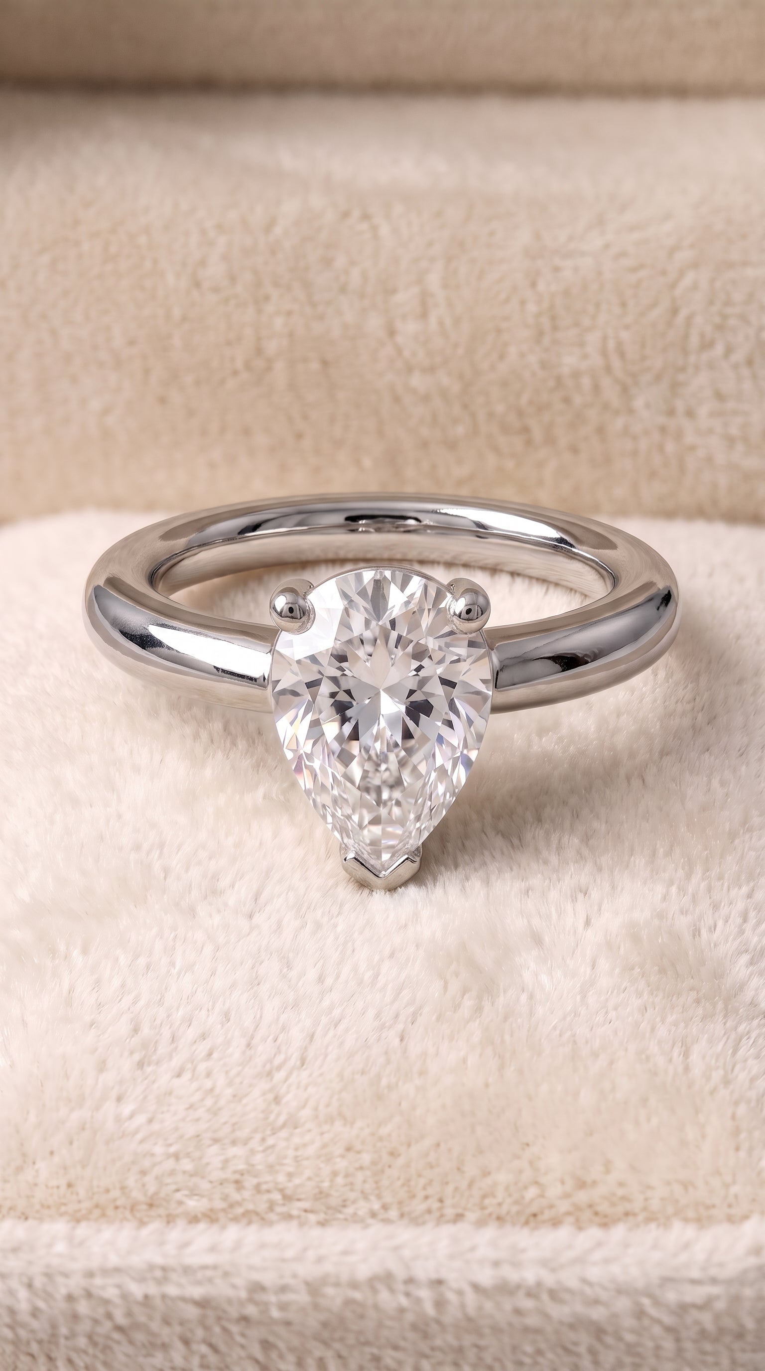 Platinum band of The Tori pear engagement ring setting | RockHer