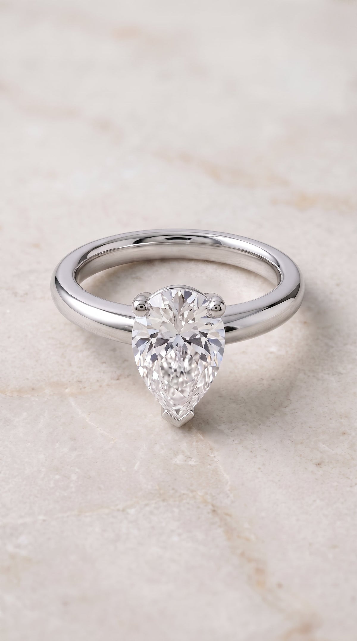 Tori Select Solitaire Pear Lab Diamond Engagement Ring in 18K White Gold, shown on hand, angled | RockHer