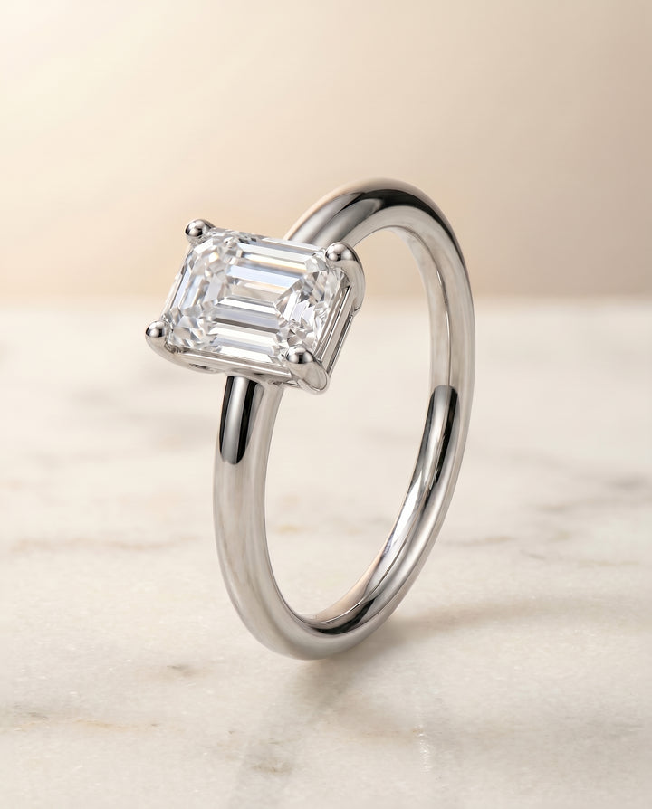 The Tori Rounded Comfort Fit Solitaire Emerald Cut Engagement Ring Setting in Platinum