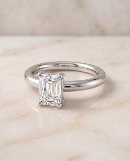 The Tori Rounded Comfort Fit Solitaire Emerald Cut Engagement Ring Setting in 18K White Gold