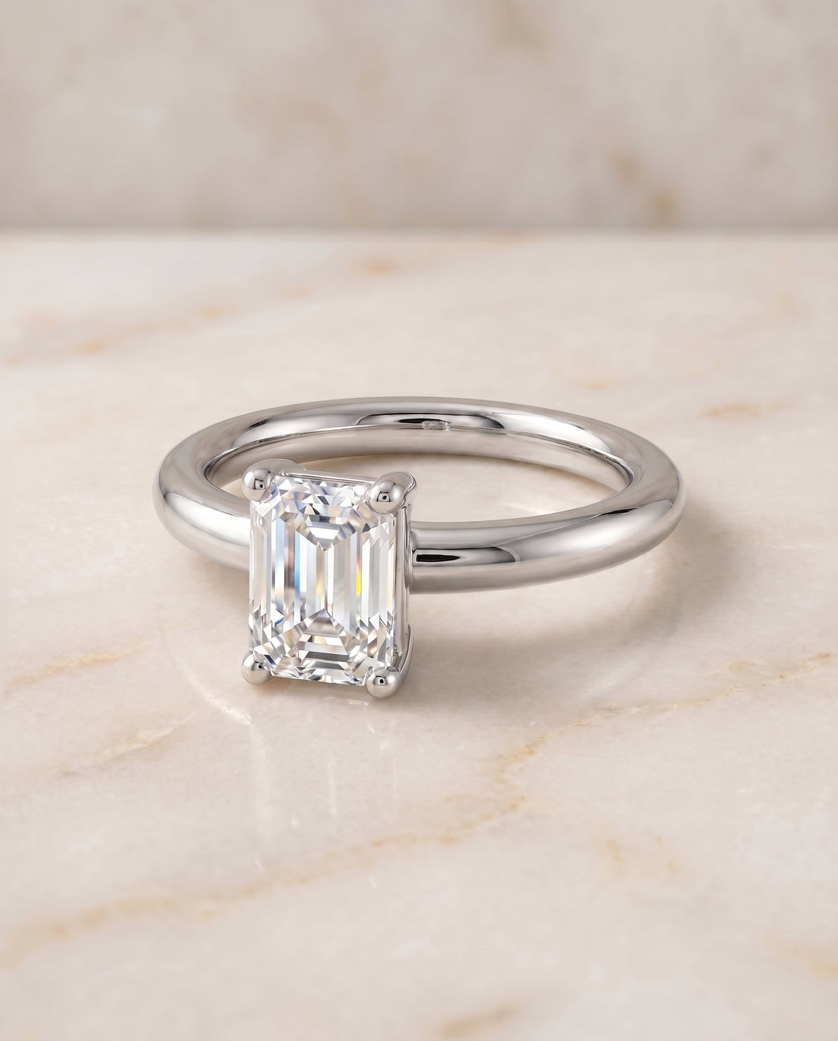 Tori Select Solitaire Emerald Cut Lab Diamond Engagement Ring in Platinum, shown on hand, angled | RockHer