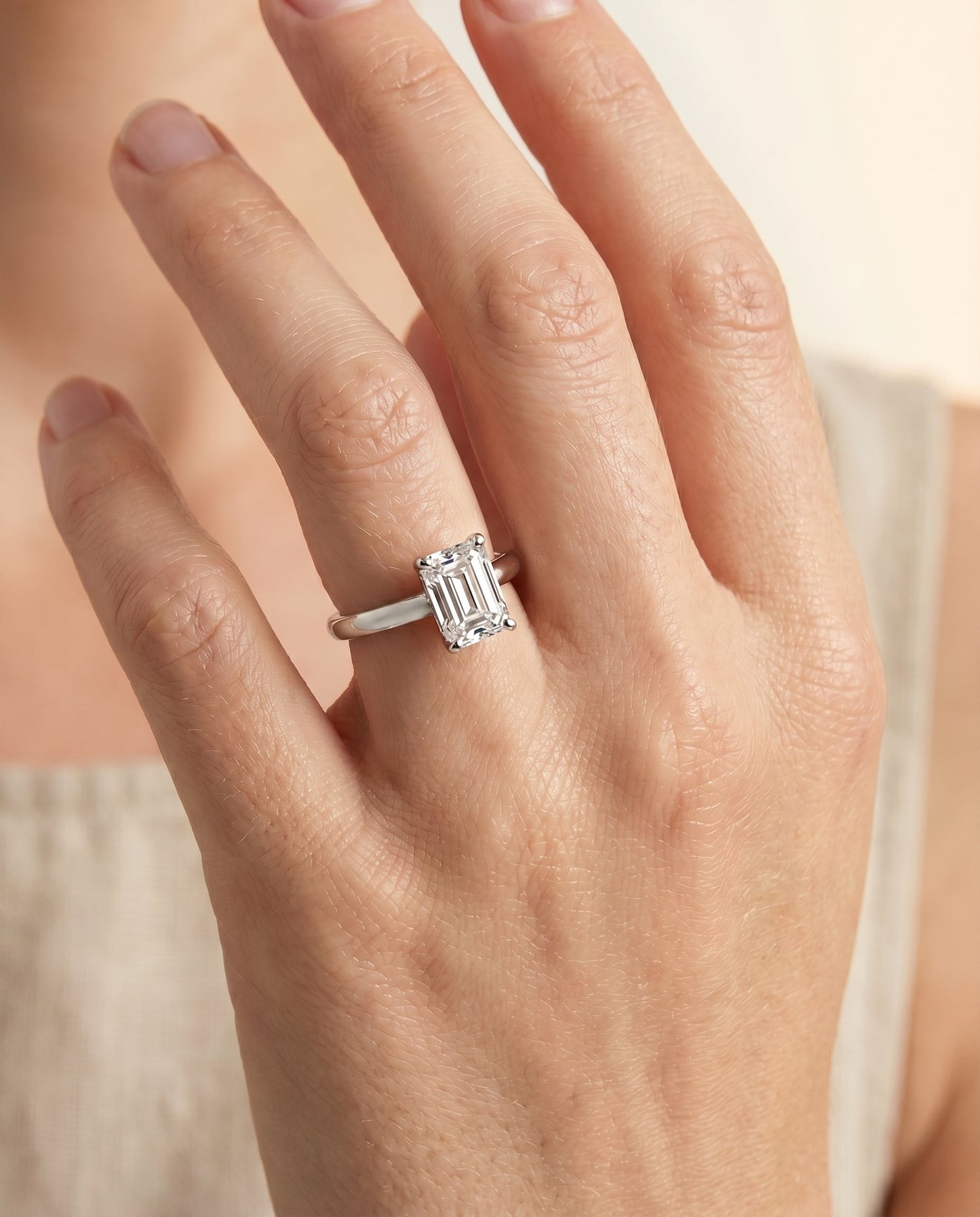 Tori Select Solitaire Emerald Cut Lab Diamond Engagement Ring in 18K White Gold, shown on hand | RockHer