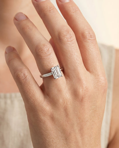 Tori Select Solitaire Emerald Cut Lab Diamond Engagement Ring in Platinum, shown on hand | RockHer