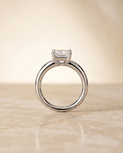 The Tori Rounded Comfort Fit Solitaire Emerald Cut Engagement Ring Setting in 18K White Gold