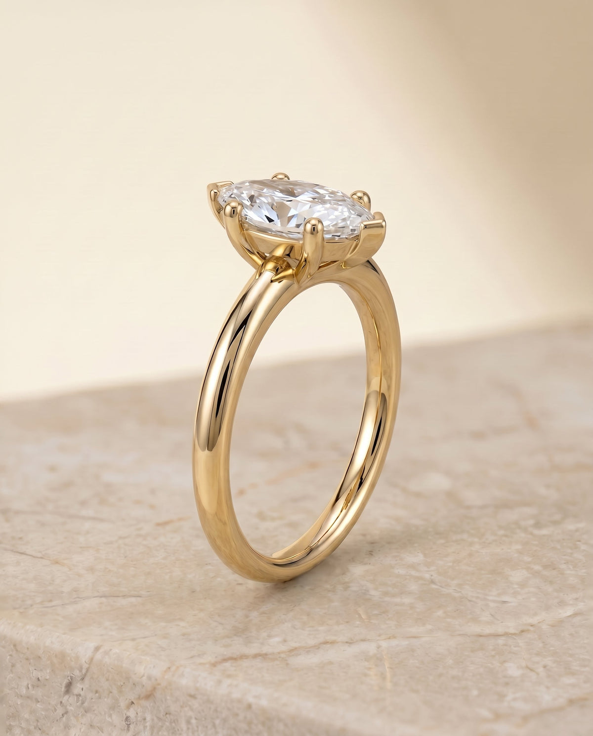 Tori Select Solitaire Marquise Lab Diamond Engagement Ring in 18K Yellow Gold, shown on hand, angled | RockHer