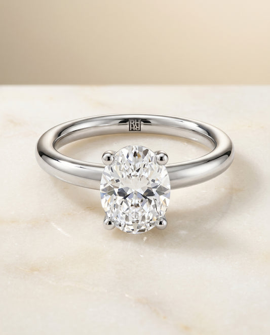 The Tori Solitaire Engagement Ring Setting for Oval Diamonds in Platinum