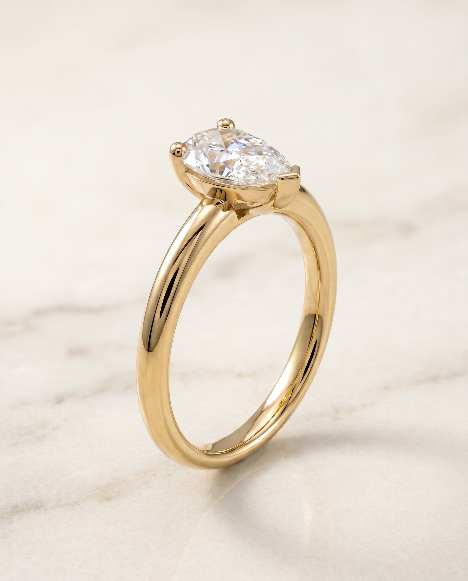 Rounded Comfort Fit Solitaire styling on The Tori pear engagement ring setting | RockHer