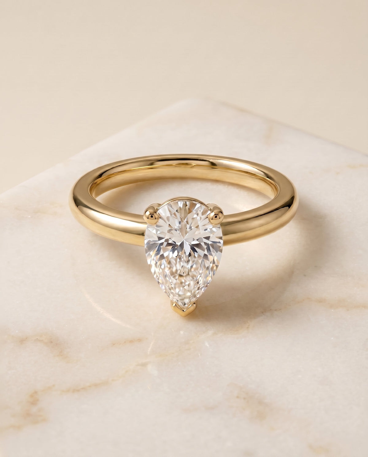 Tori Select Solitaire Pear Lab Diamond Engagement Ring in 18K Yellow Gold, shown on hand, angled | RockHer