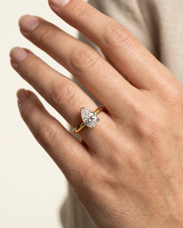 Tori Select Solitaire Pear Lab Diamond Engagement Ring in 18K Yellow Gold, shown on hand | RockHer