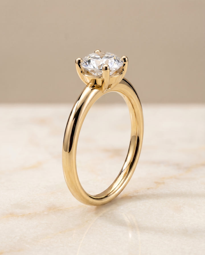 The Tori Solitaire Engagement Ring Setting for Round Diamonds in 18K Yellow Gold
