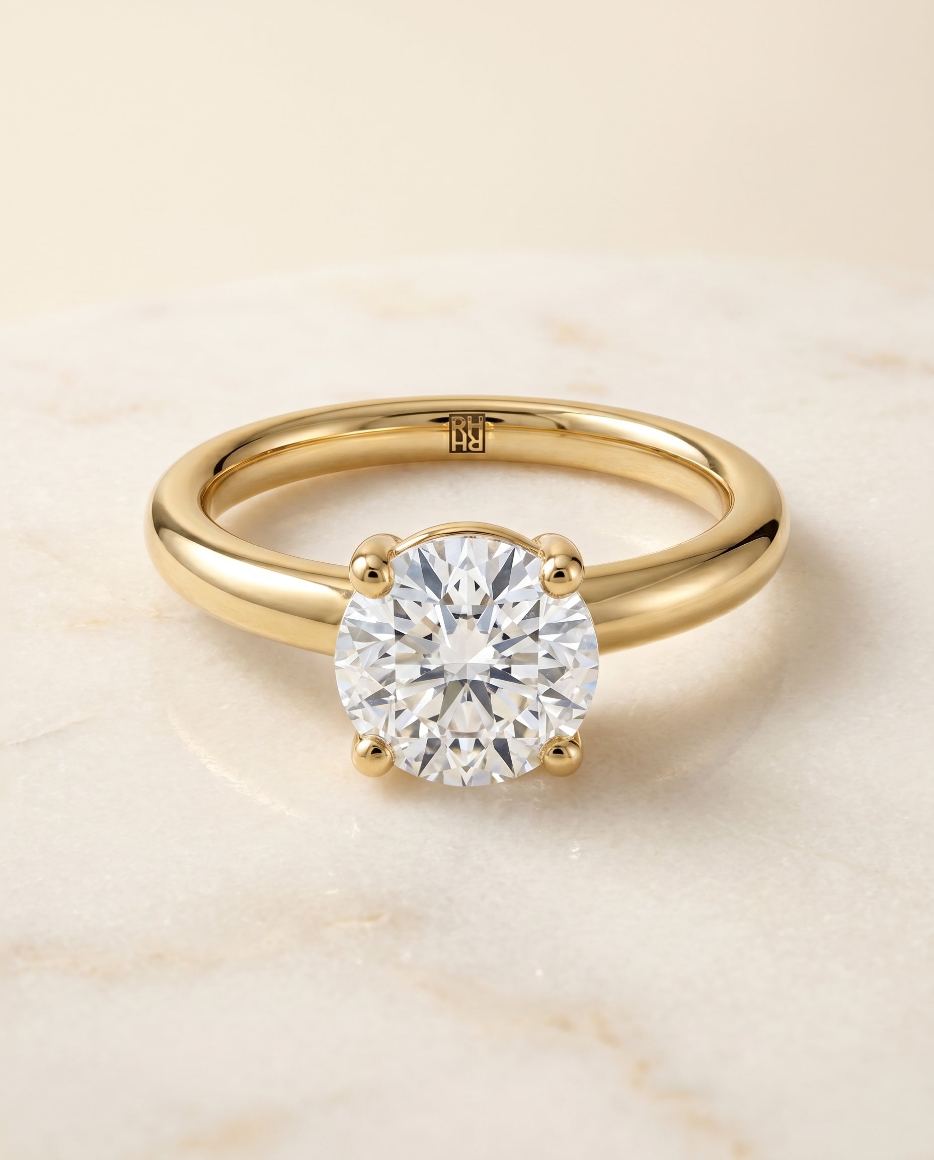 The Tori Solitaire Engagement Ring Setting for Round Diamonds in 18K Yellow Gold