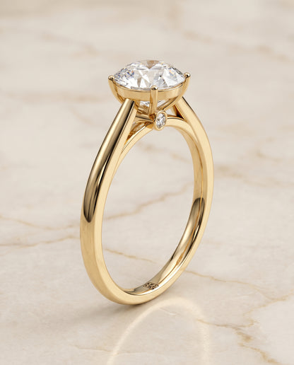 The Valerie Comfort Fit Secret Stone Solitaire Round Engagement Ring Setting in 18K Yellow Gold