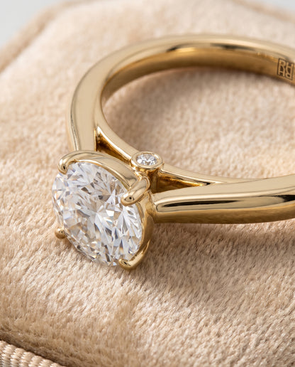 The Valerie Comfort Fit Secret Stone Solitaire Round Engagement Ring Setting in 18K Yellow Gold