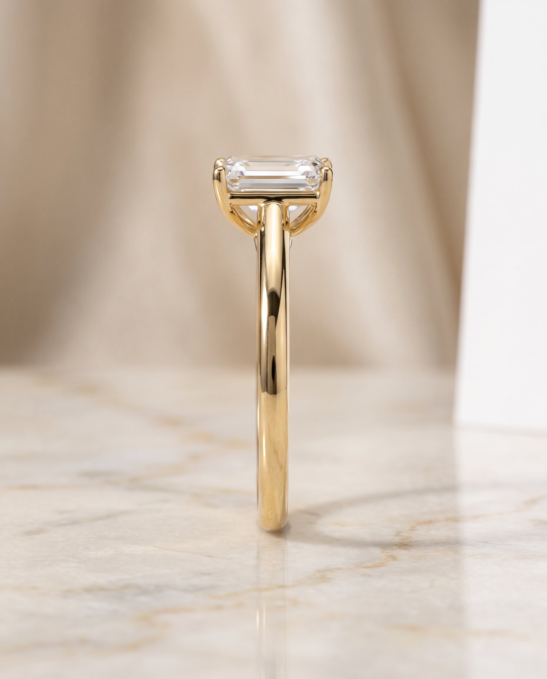 The Viola Contemporary Comfort Fit Flat Shank Solitaire Emerald Cut Engagement Ring Setting in 18K Yellow Gold