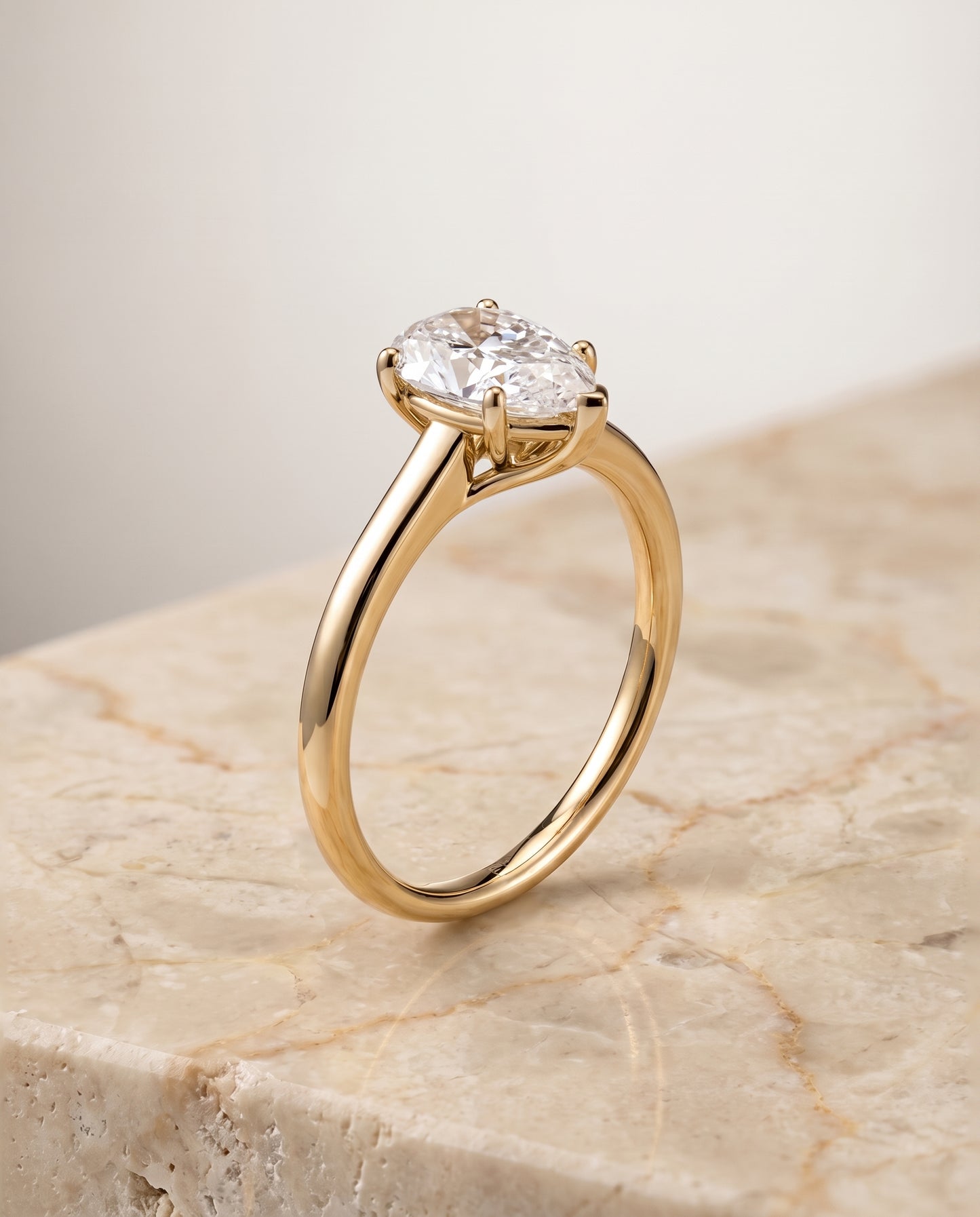 The Viola Contemporary Comfort Fit Flat Shank Solitaire Pear Engagement Ring Setting in 18K Yellow Gold