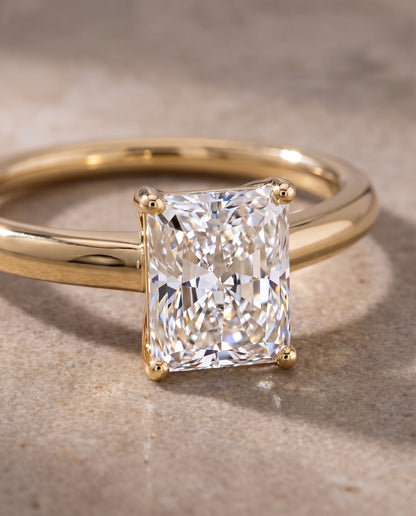 The Viola Contemporary Comfort Fit Flat Shank Solitaire Radiant Cut Engagement Ring Setting in 18K Yellow Gold