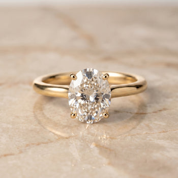 The Viola Contemporary Comfort Fit Flat Shank Solitaire Oval Engagement Ring Setting in 18K Yellow Gold