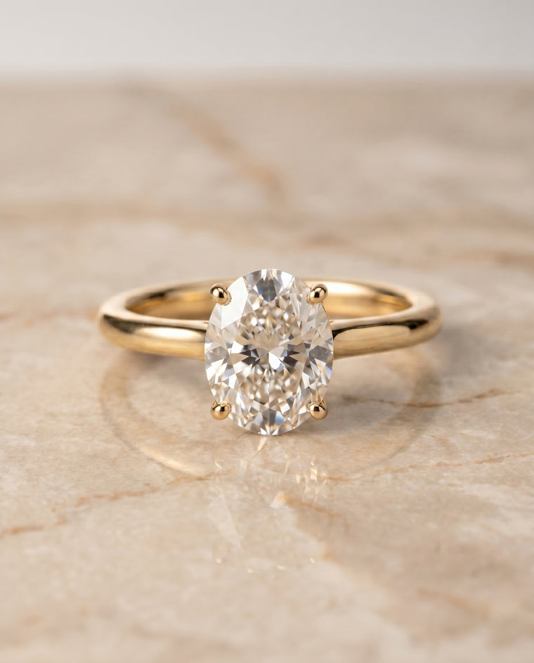 The Viola Contemporary Comfort Fit Flat Shank Solitaire Oval Engagement Ring Setting in 18K Yellow Gold