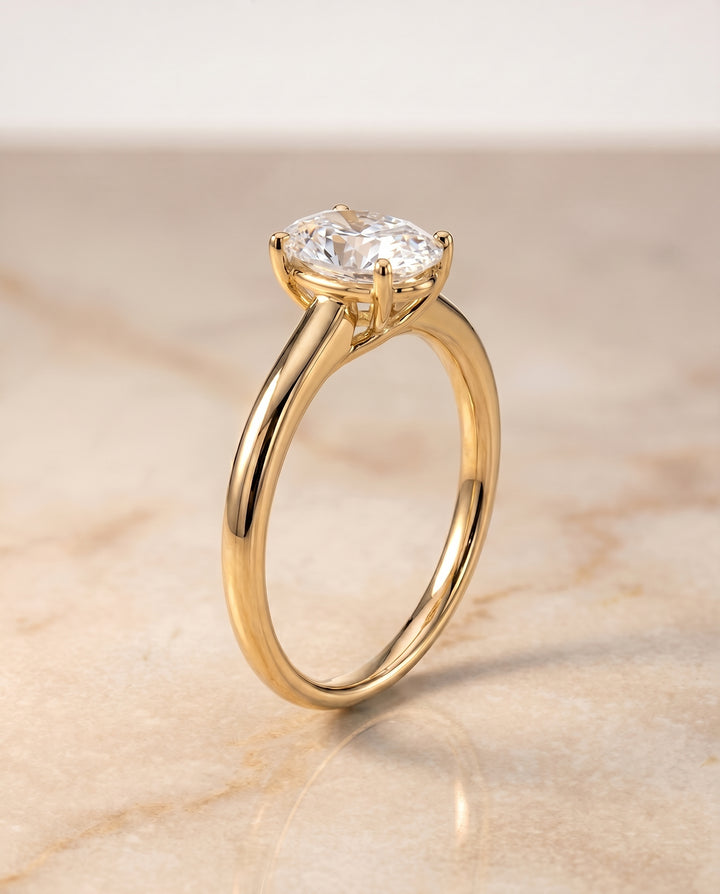 The Viola Contemporary Comfort Fit Flat Shank Solitaire Oval Engagement Ring Setting in 18K Yellow Gold