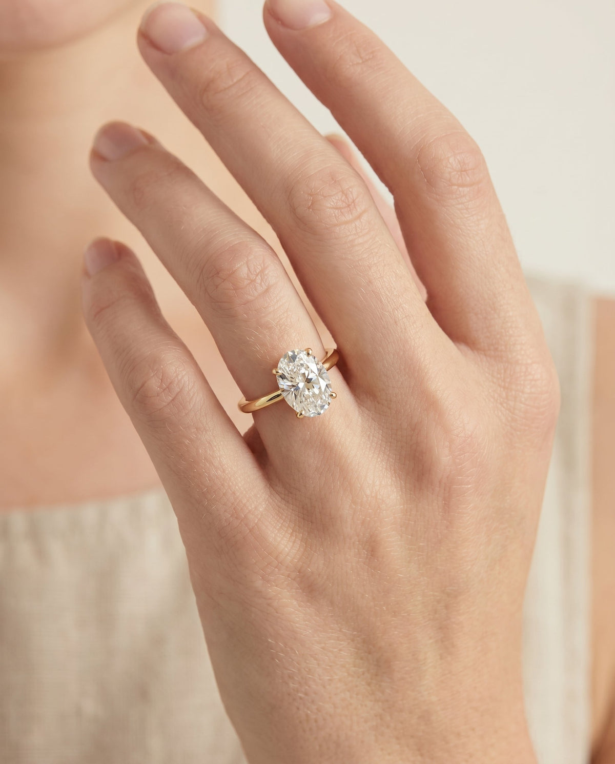 Viola Select Solitaire Oval Lab Diamond Engagement Ring in 18K Yellow Gold, shown on hand | RockHer