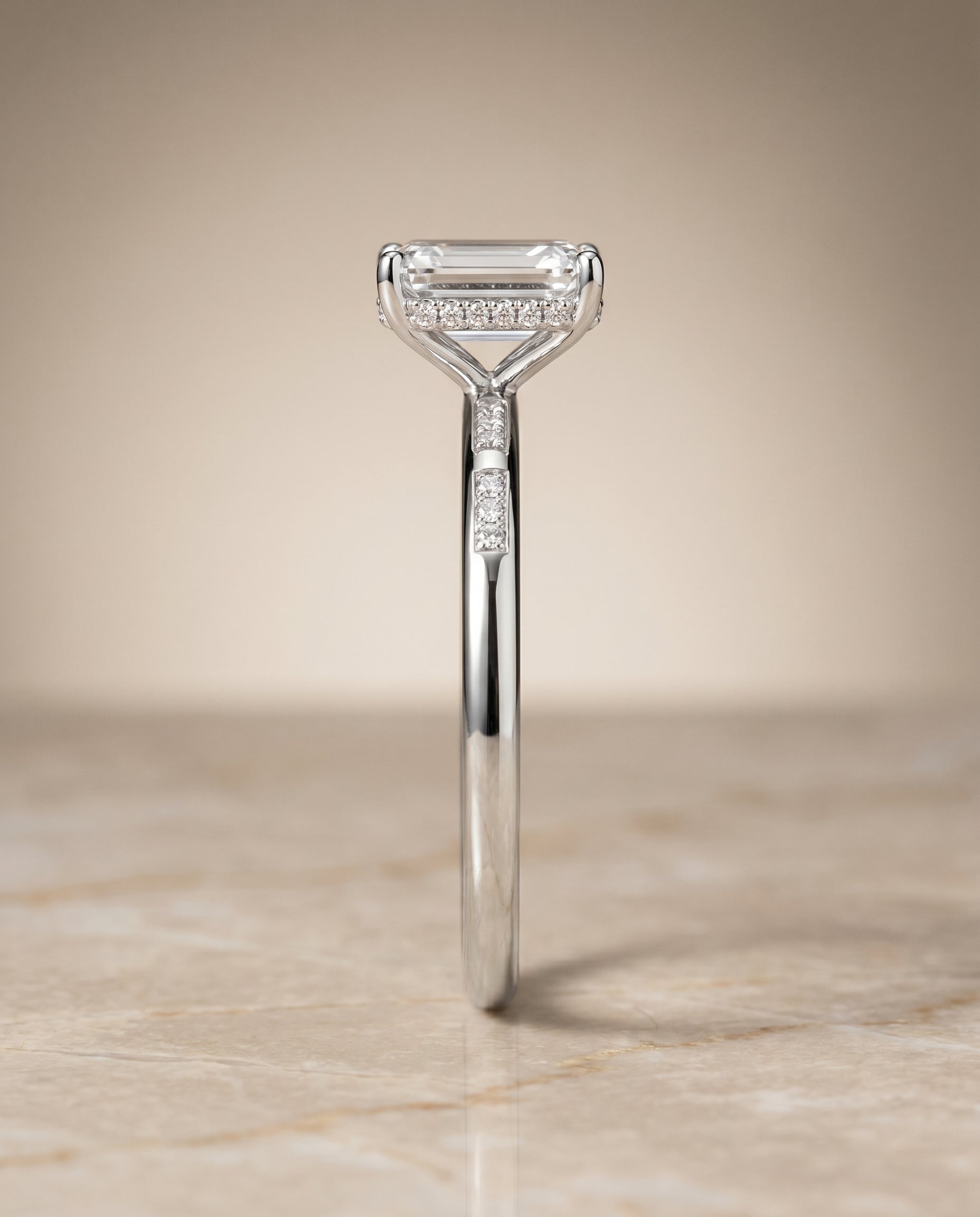Hidden Halo Pavé Solitaire Cut styling on The Wanda emerald engagement ring setting | RockHer