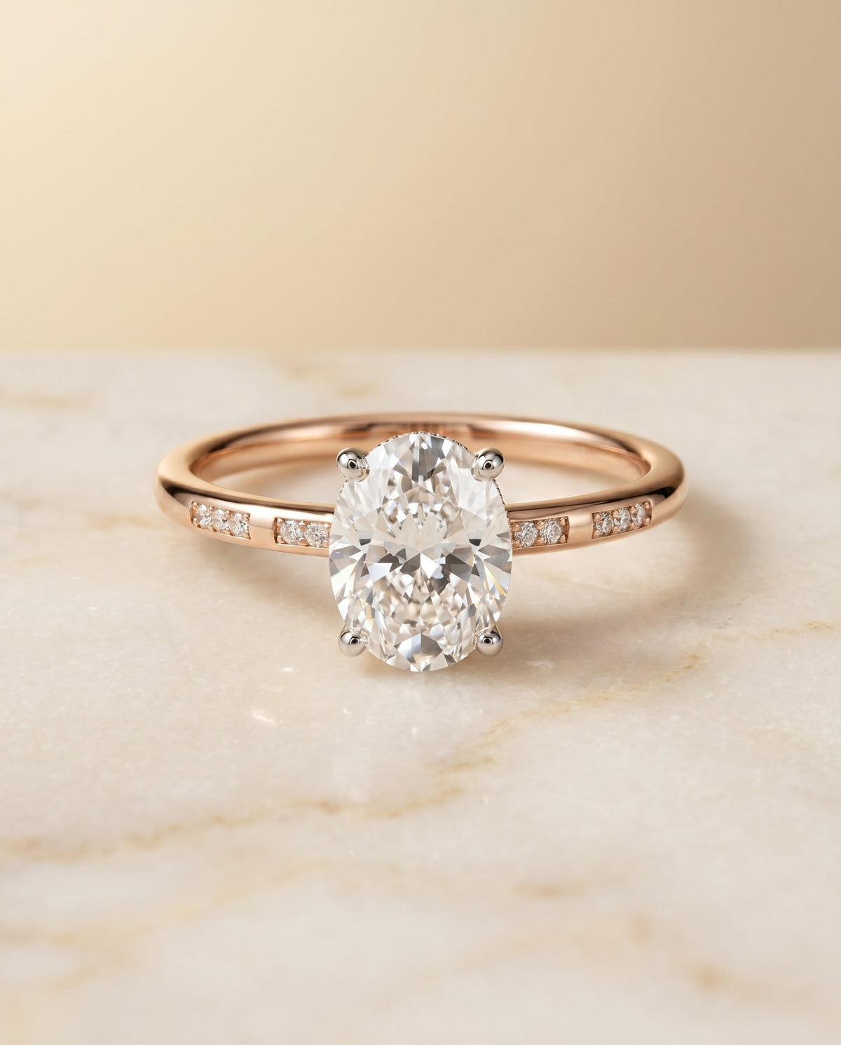 Wanda Select Hidden Halo Pavé Solitaire Oval Lab Diamond Engagement Ring in 14K Rose Gold, shown on hand, angled | RockHer