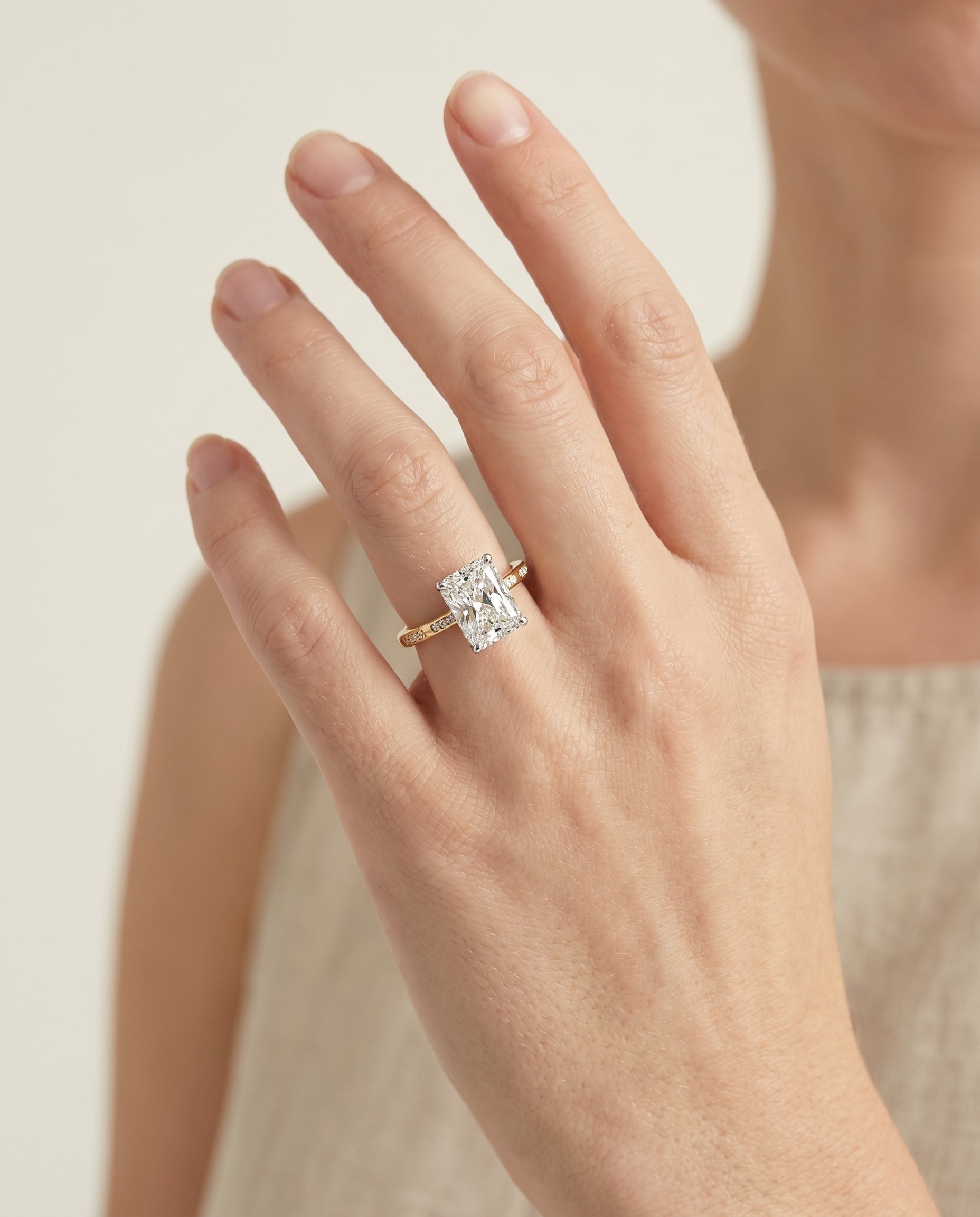The Wanda engagement ring setting in 18K Yellow Gold, hidden halo pavé solitaire cut design | RockHer