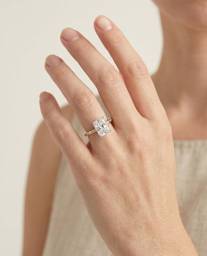 Wanda Select Hidden Halo Pavé Solitaire Radiant Cut Lab Diamond Engagement Ring in 18K Yellow Gold, shown on hand | RockHer