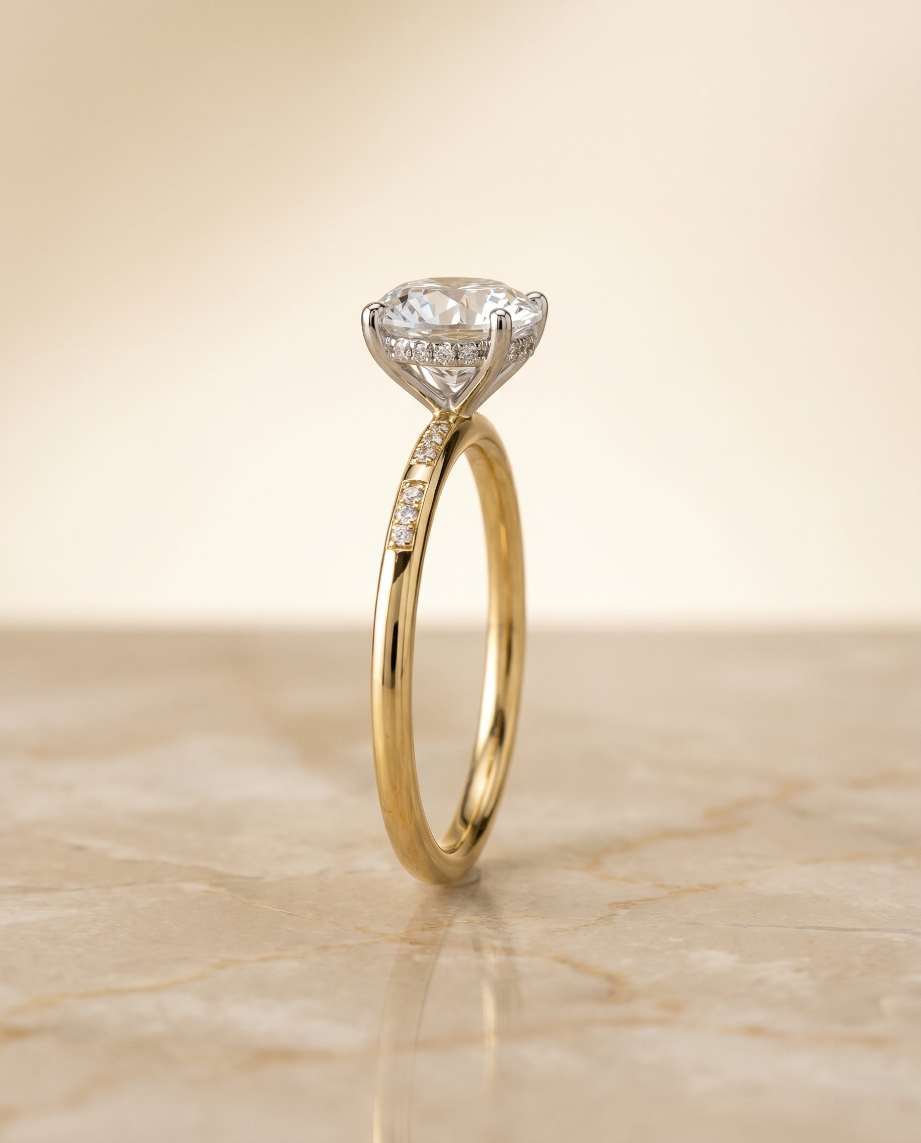 The Wanda hidden halo pavé solitaire engagement ring setting, shown in 18K Yellow Gold | RockHer