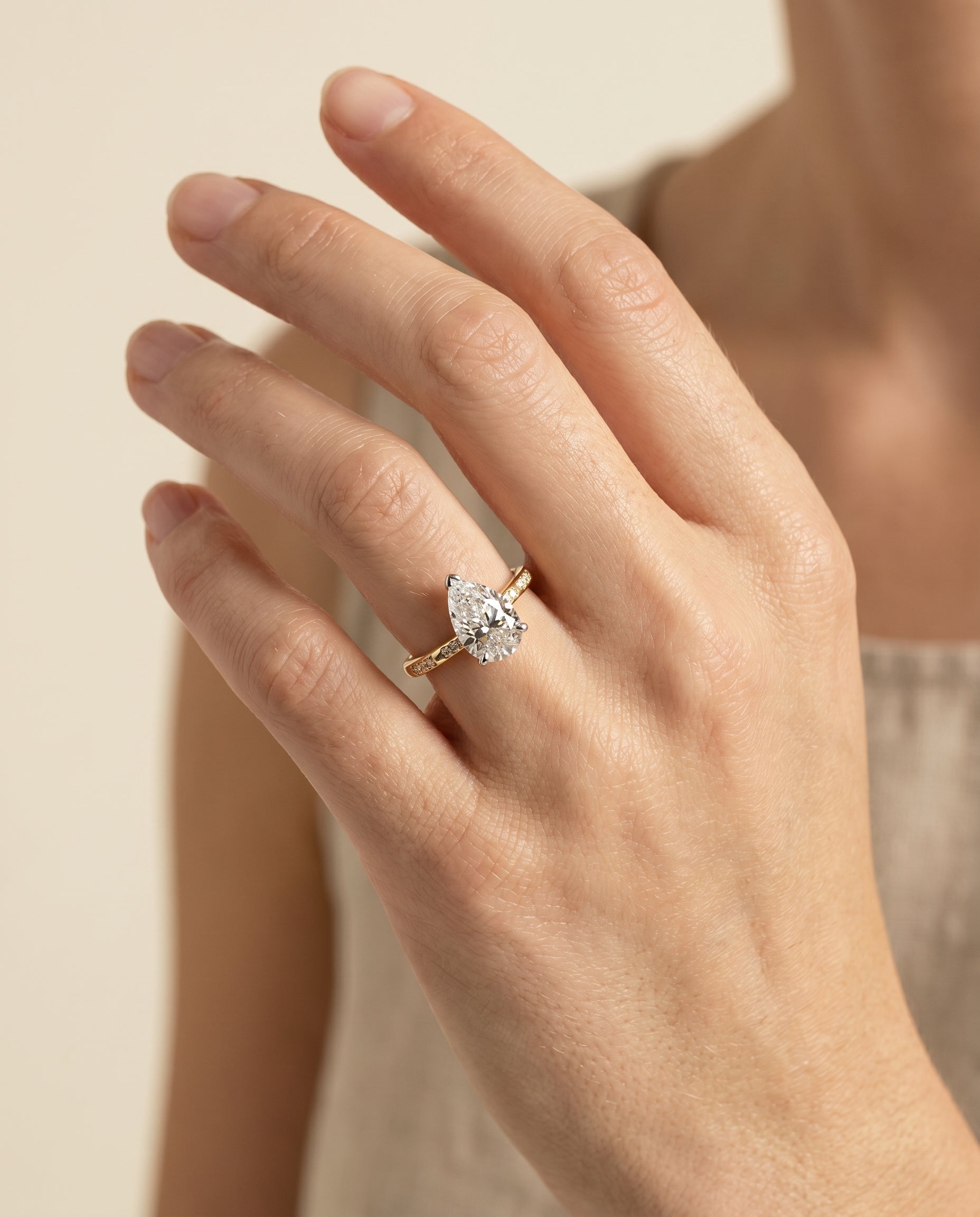 The Wanda engagement ring setting in 18K Yellow Gold, hidden halo pavé solitaire design | RockHer