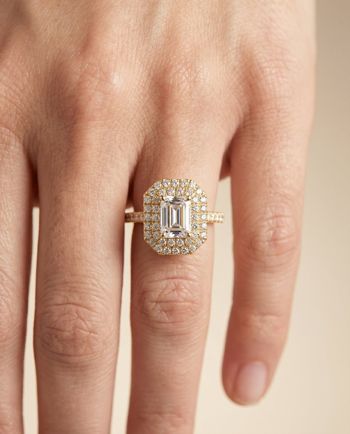 Whitney Select Double Halo Emerald Cut Lab Diamond Engagement Ring in 18K Yellow Gold, shown on hand | RockHer