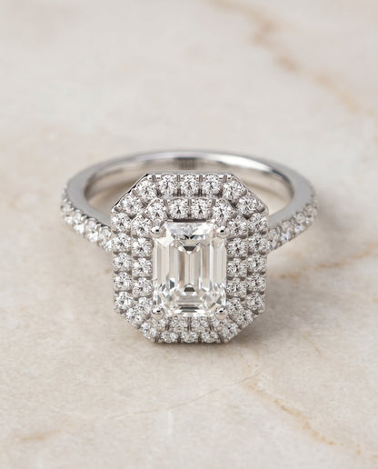 Whitney Select Double Halo Emerald Cut Lab Diamond Engagement Ring in 18K White Gold, shown on hand, angled | RockHer