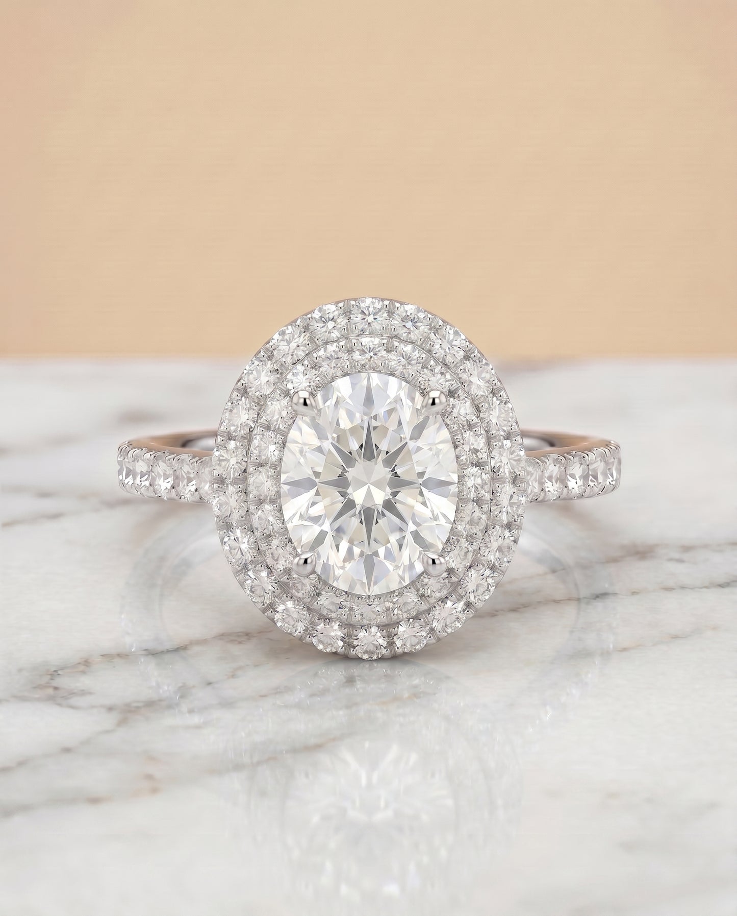 The Whitney Pavé Halo Engagement Ring Setting for Oval Diamonds in 18K White Gold